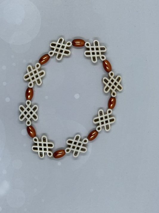 Ivory Endless Knot Bracelet with Copper-Tone Oval Beads – Stretch Fit