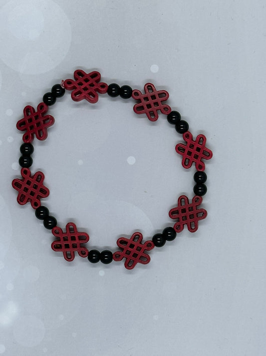 Red Endless Knot Bracelet with Black Beads – Handmade Symbolic Jewelry